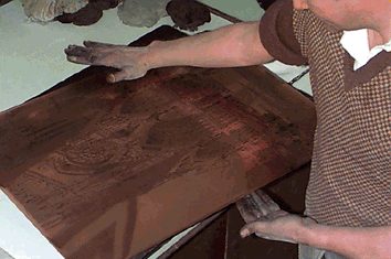 copper plate printing - wilipng the plate by hand